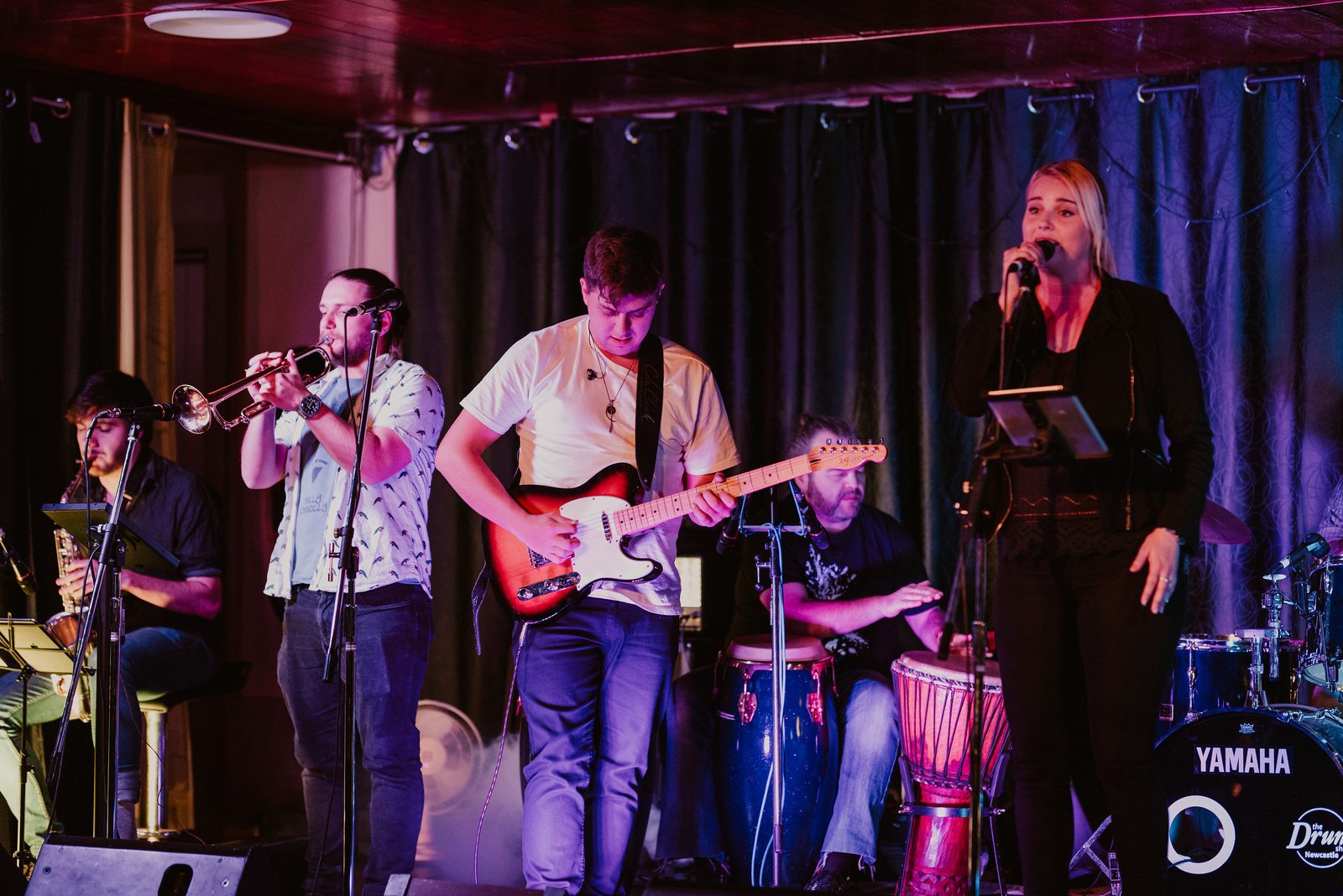 Adrianna Mac band performing live on stage